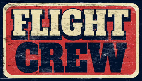 Aged retro flight crew sign on wood