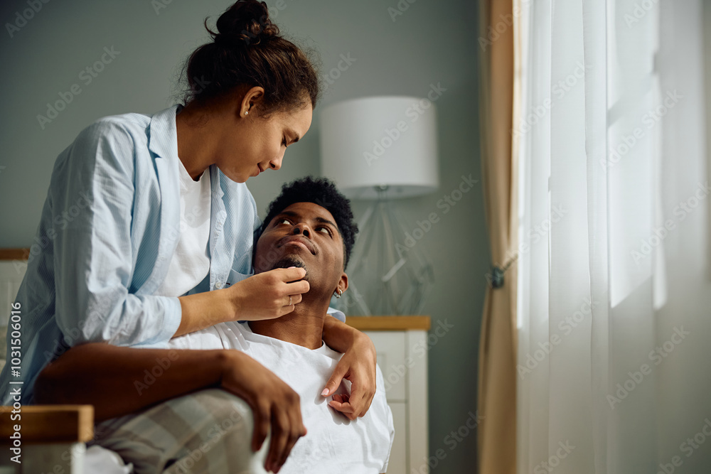 Young multiracial couple in love enjoying in morning together at home. Young multiracial couple in love enjoying in morning together at home.