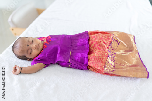 Photography ndian family spending time together, wearing traditional and casual outfits with a baby, a young girl, and grandparents in a high-rise apartment in Kuala Lumpur, Malaysia