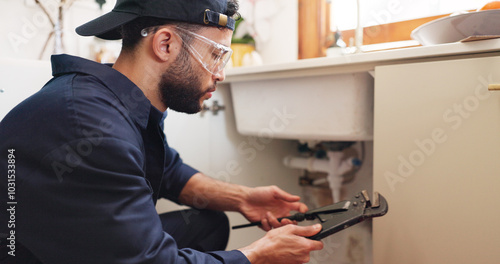 Plumber, house or handyman with wrench for maintenance, skills or small business. Person, employee or repair with equipment, safety or industry with service, home renovation or labour with contractor