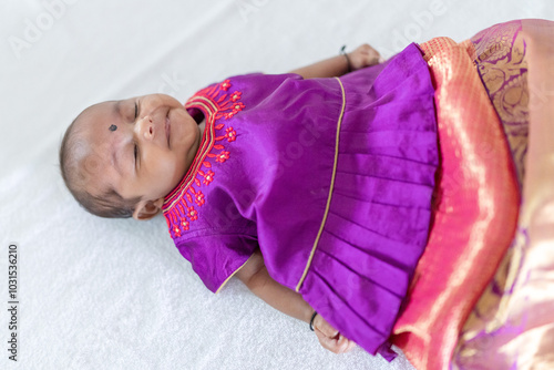 Photography ndian family spending time together, wearing traditional and casual outfits with a baby, a young girl, and grandparents in a high-rise apartment in Kuala Lumpur, Malaysia