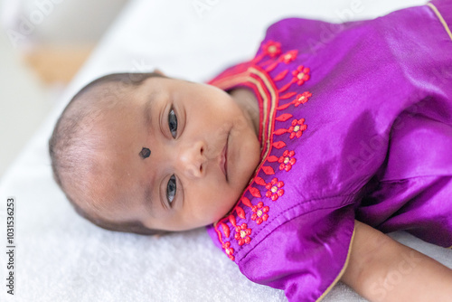 Photography ndian family spending time together, wearing traditional and casual outfits with a baby, a young girl, and grandparents in a high-rise apartment in Kuala Lumpur, Malaysia