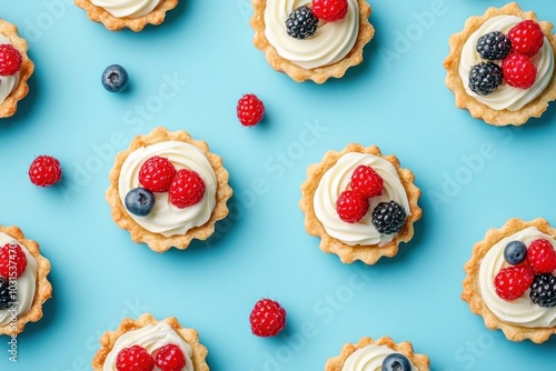 Sweet Berry Tartlets on a Blue Background