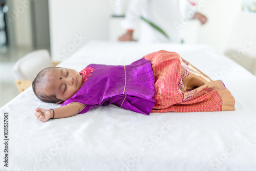 Photography ndian family spending time together, wearing traditional and casual outfits with a baby, a young girl, and grandparents in a high-rise apartment in Kuala Lumpur, Malaysia