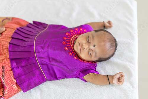 Photography ndian family spending time together, wearing traditional and casual outfits with a baby, a young girl, and grandparents in a high-rise apartment in Kuala Lumpur, Malaysia