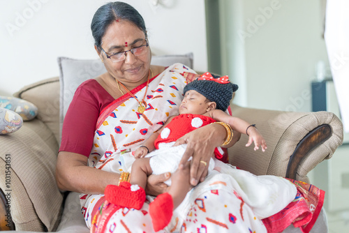 Photography ndian family spending time together, wearing traditional and casual outfits with a baby, a young girl, and grandparents in a high-rise apartment in Kuala Lumpur, Malaysia