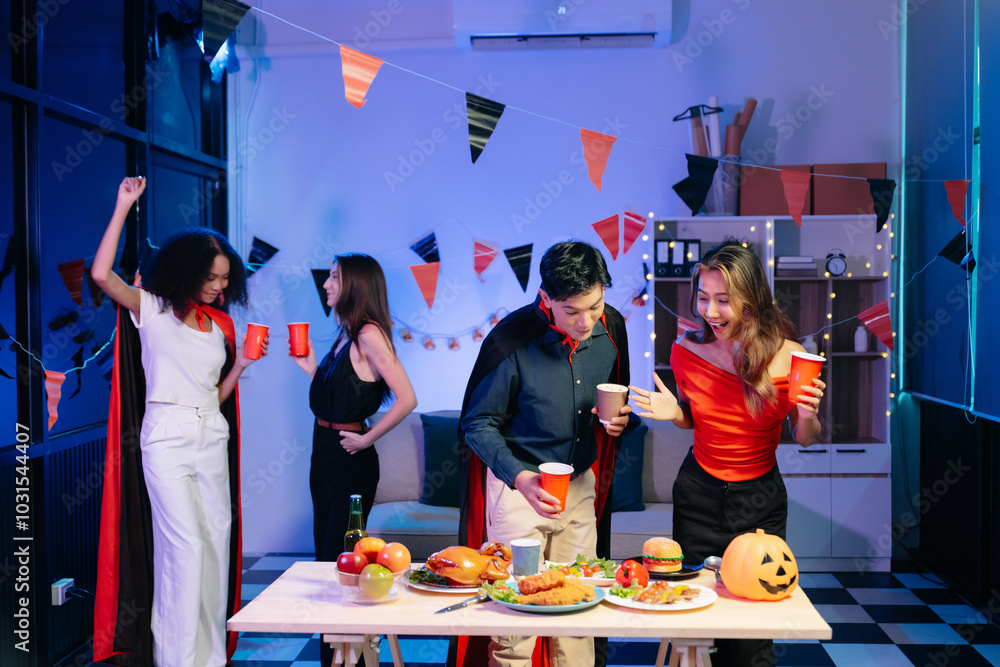 Joyful friends in vibrant Halloween costumes share drinks and laughter at a festive indoor party. Joyful friends in vibrant Halloween costumes share drinks and laughter at a festive indoor party.