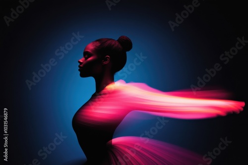 Ballerina posing with light trails flowing around her