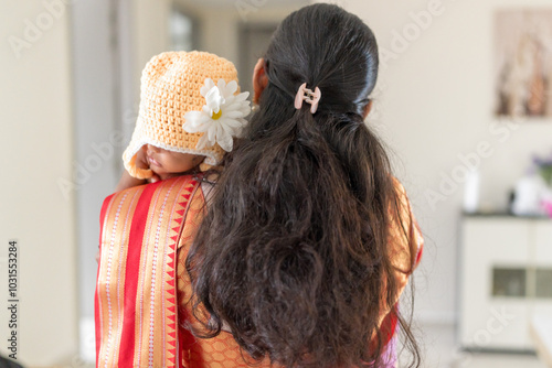 Photography ndian family spending time together, wearing traditional and casual outfits with a baby, a young girl, and grandparents in a high-rise apartment in Kuala Lumpur, Malaysia