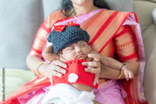 Photography ndian family spending time together, wearing traditional and casual outfits with a baby, a young girl, and grandparents in a high-rise apartment in Kuala Lumpur, Malaysia