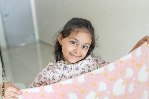 Photography ndian family spending time together, wearing traditional and casual outfits with a baby, a young girl, and grandparents in a high-rise apartment in Kuala Lumpur, Malaysia