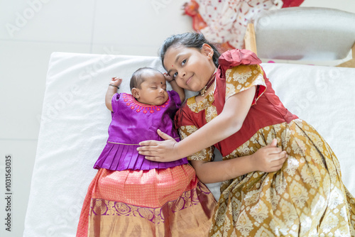 Photography ndian family spending time together, wearing traditional and casual outfits with a baby, a young girl, and grandparents in a high-rise apartment in Kuala Lumpur, Malaysia