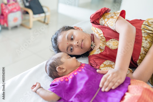 Photography ndian family spending time together, wearing traditional and casual outfits with a baby, a young girl, and grandparents in a high-rise apartment in Kuala Lumpur, Malaysia