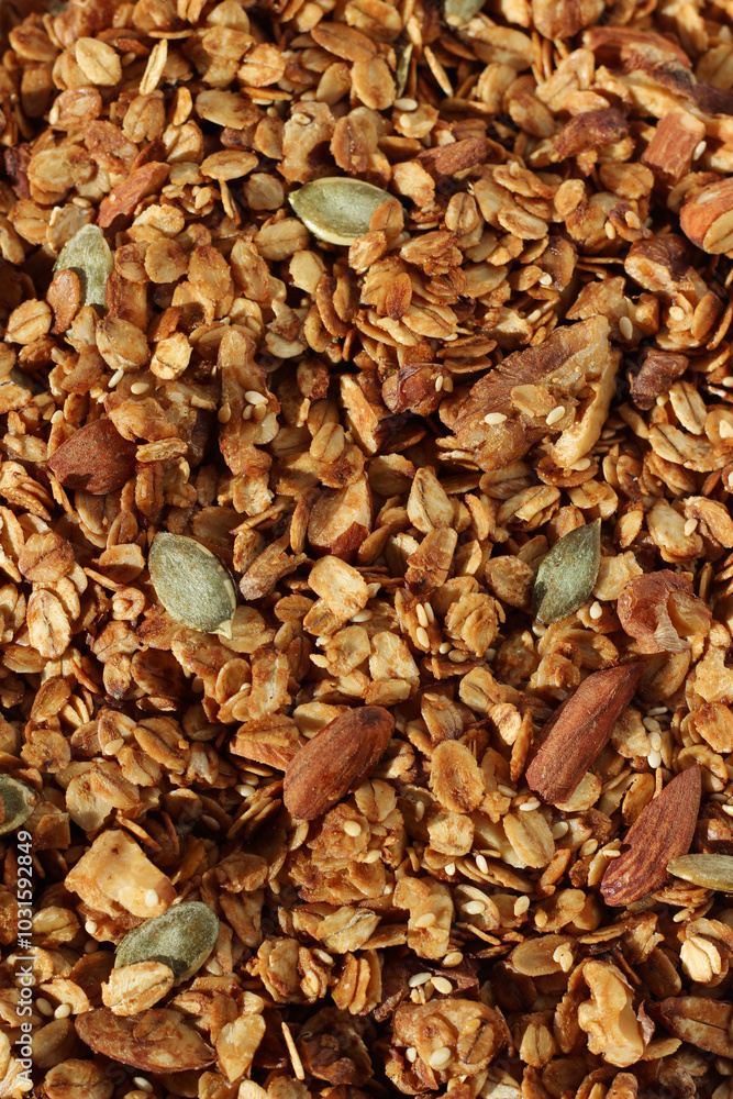 Oat Granola with Almonds, Walnuts, Sesame and Pumpkin Seeds, Closeup Full Frame Background. Cereals. Oat Granola with Almonds, Walnuts, Sesame and Pumpkin Seeds, Closeup Full Frame Background. Cereals.