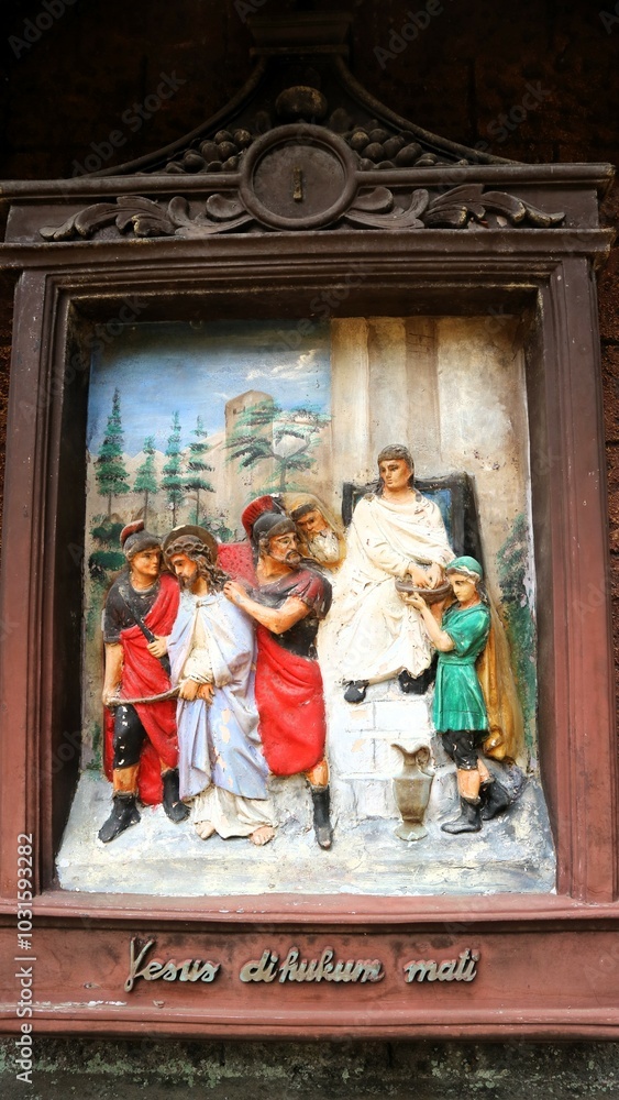 A wall relief depicting the Stations of the Cross, A wall sculpture depicting the Stations of the Cross, Jesus suffering during Via Dolorosa A wall relief depicting the Stations of the Cross, A wall sculpture depicting the Stations of the Cross, Jesus suffering during Via Dolorosa