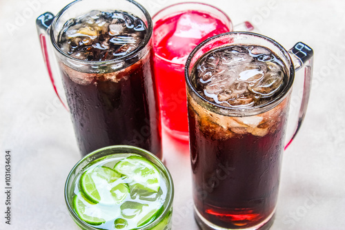 a few glasses of fizzy drink with ice