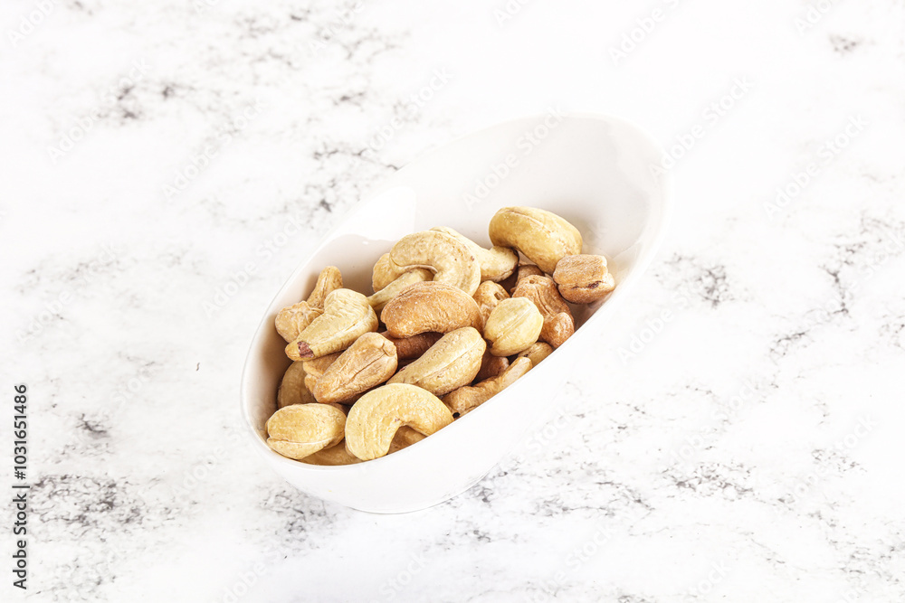 Cashew nuts heap in the bowl Cashew nuts heap in the bowl