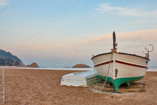 Mediterranean beach of Tossa de Mar. Rowing boat, Girona, Spain photo