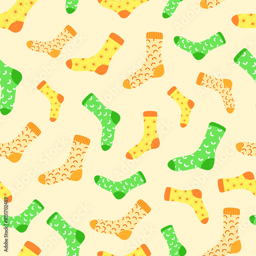 Vector pattern with colorful cute yellow, orange, green socks on a yellow background