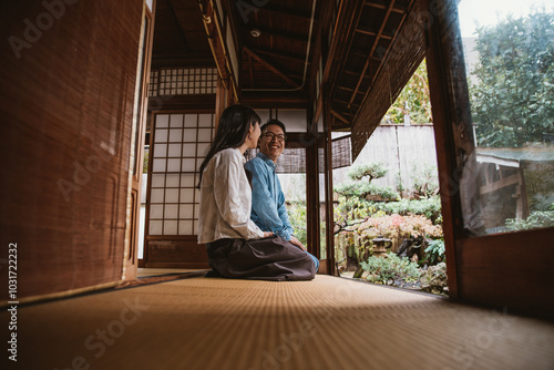 Canvas Print Young japanese couple spending time in their house