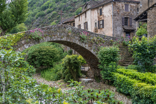 Brousse, France. 05-29-2024. Old paved stone bridge  at Brousse le Chateau. Aveyron. Occitanie. France. photo