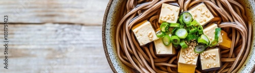 Bowl of soba noodles with tofu, scallions, and sesame oil, vegetarian food, Japaneseinspired dish photo