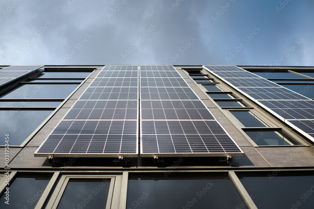 Modern urban architecture, photovoltaic panels on the building's facade, electricity production.
