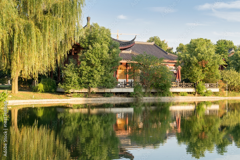 Obraz premium red old building in china with pagodas on the lake shore