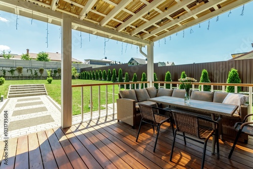 Konstfotografi Serene Outdoor Patio with Comfortable Seating and Greenery