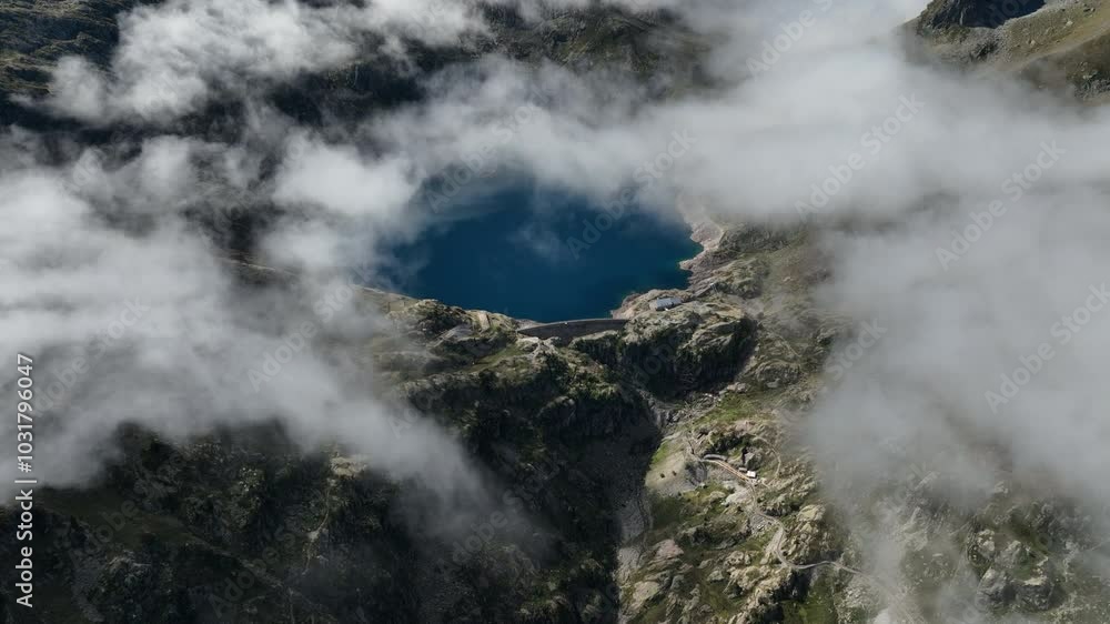 Aerial drone view of the spectacular Artouste lake in the Pyrenees Mountains in a beautiful summer day enjoying nature and outdoors Aerial drone view of the spectacular Artouste lake in the Pyrenees Mountains in a beautiful summer day enjoying nature and outdoors