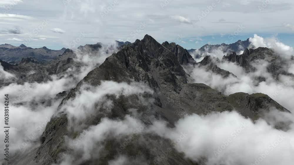 Aerial drone Timelapse of a beautiful mountain range with clouds and a sunny day in the Pyrenees, France Aerial drone Timelapse of a beautiful mountain range with clouds and a sunny day in the Pyrenees, France