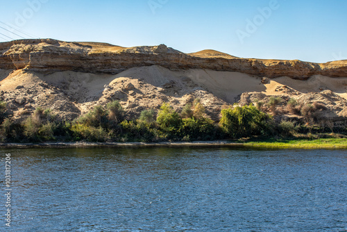 Embark on a peaceful journey along the Nile River, surrounded by breathtaking landscapes. Explore ancient wonders, relax on the sundeck, and connect with nature. photo