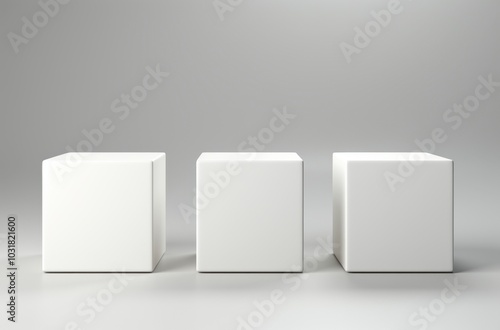 Three white cubes stand on a light gray background.