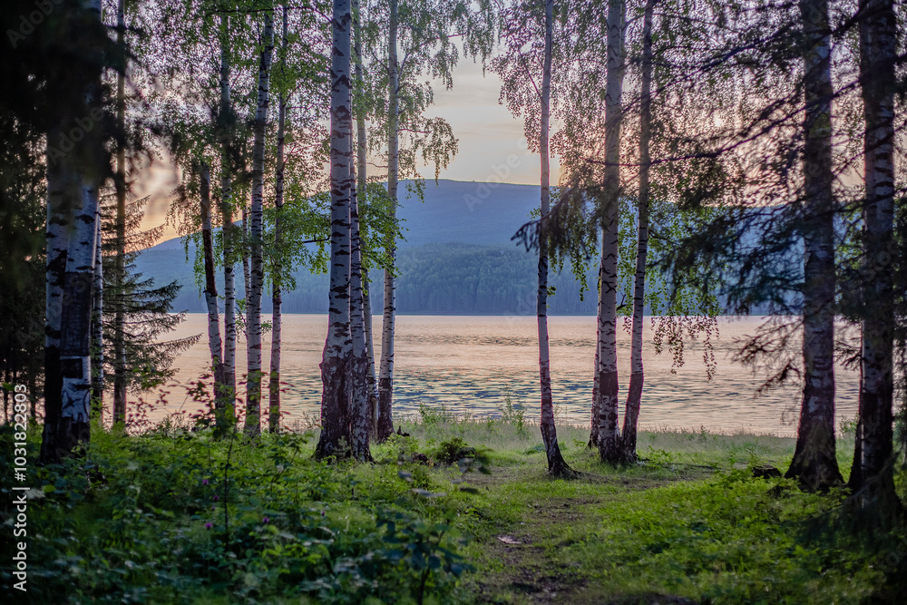 Sunset in the city of Kachkanar on the embankment of the reservoir. July 2024. Sunset in the city of Kachkanar on the embankment of the reservoir. July 2024.
