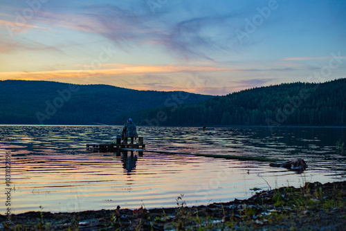 Sunset in the city of Kachkanar on the embankment of the reservoir. July 2024.