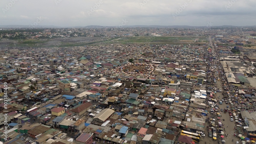 People live in slums immersed immersed in toxic waste that poisons the land and river waters in Africa Africa Ghana AGBOGBLOSHIE. high environmental pollution area , Climate change global warming