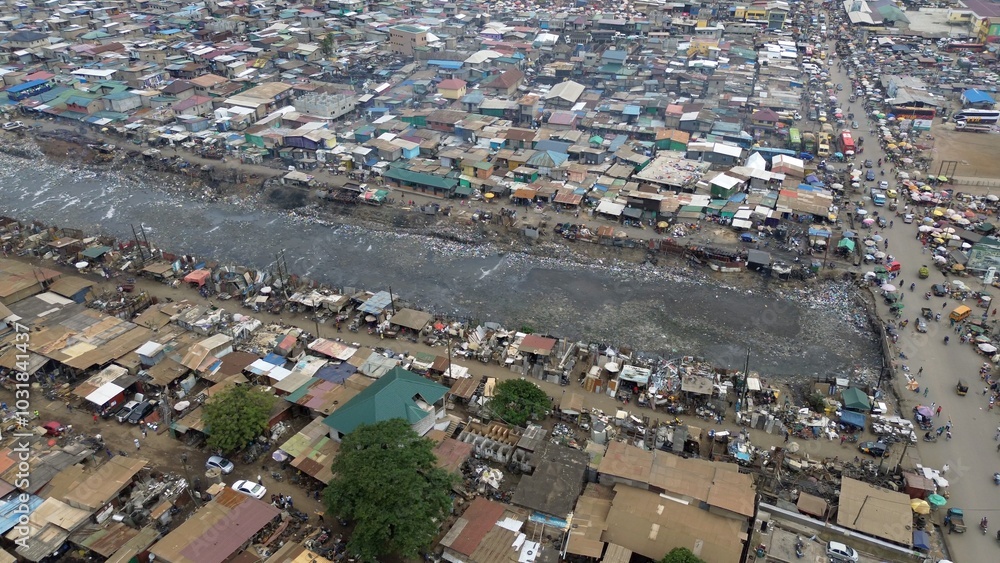 Ghana, Accra, AGBOGBLOSHIE drone view Odaw River the largest landfill illegal dump in Africa for electronic and plastic waste from the Western world. mountain of toxic waste, environmental disaster
