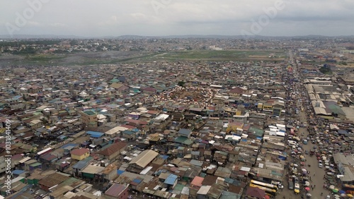 Obraz na płótnie People live in slums immersed immersed in toxic waste that poisons the land and river waters in Africa Africa Ghana AGBOGBLOSHIE. high environmental pollution area , Climate change global warming w salonie