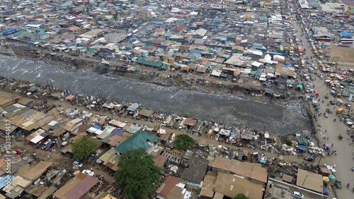Obraz na płótnie Ghana, Accra, AGBOGBLOSHIE drone view Odaw River the largest landfill illegal dump in Africa for electronic and plastic waste from the Western world. mountain of toxic waste, environmental disaster w salonie