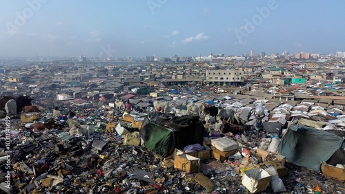 Ghana, Accra,   AGBOGBLOSHIE drone view Odaw River the largest landfill illegal dump in Africa for electronic and plastic waste from the Western world. mountain of toxic waste, environmental disaster 