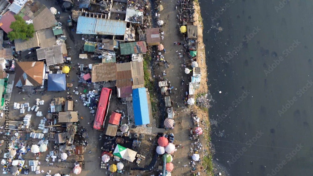 People live in slums immersed immersed in toxic waste that poisons the land and river waters in Africa Africa Ghana AGBOGBLOSHIE. high environmental pollution area , Climate change global warming