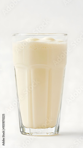 Vanilla Smoothie Delight, a tall glass brimming with creamy white vanilla smoothie set against a clean white background, refreshing indulgence