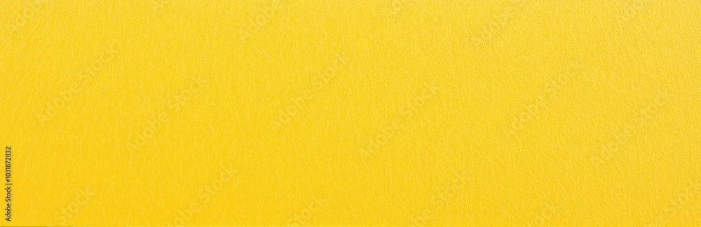 Fototapeta premium Bright yellow plain paper texture with a smooth finish