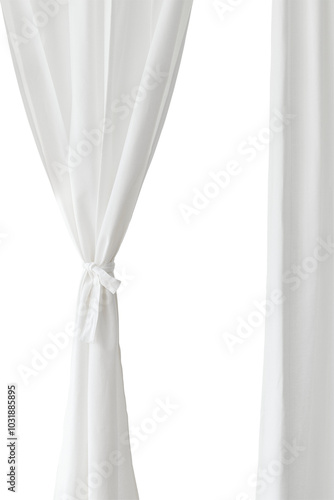 White drapery hanging from a curtain rod design element