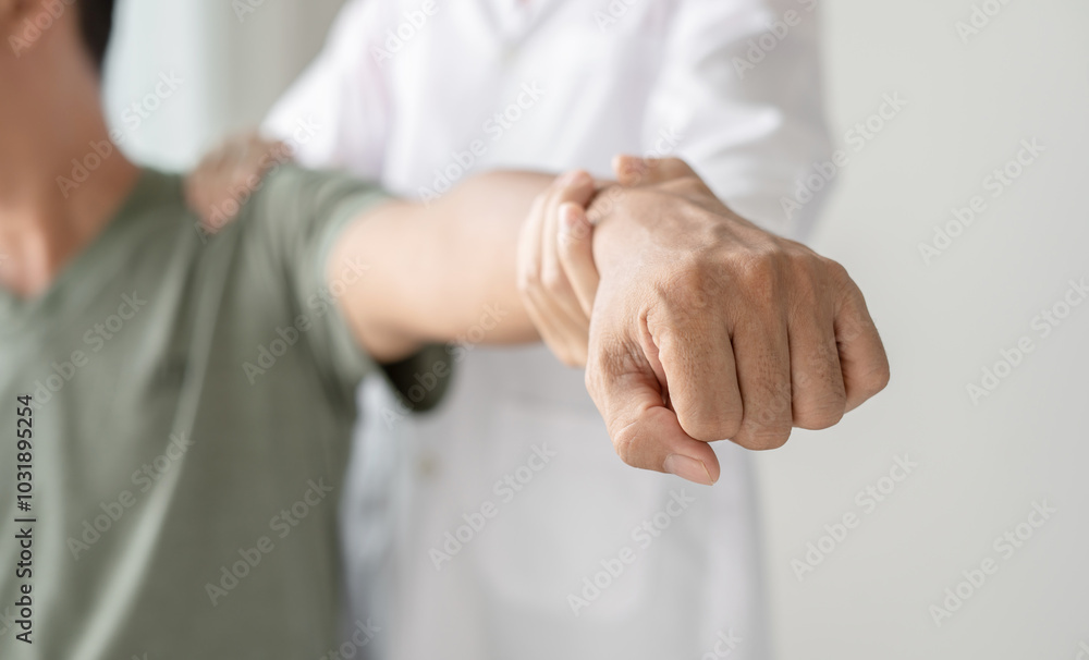 Female physiotherapists provide physical assistance to male patients with shoulder injuries massaging their shoulders for muscle recovery in the rehabilitation center. Physiotherapy concepts Female physiotherapists provide physical assistance to male patients with shoulder injuries massaging their shoulders for muscle recovery in the rehabilitation center. Physiotherapy concepts