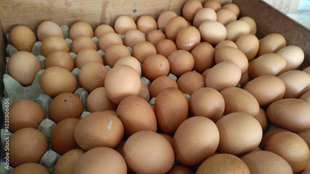 Fresh eggs neatly arranged in wooden crates being sold in front of the shop Fresh eggs neatly arranged in wooden crates being sold in front of the shop