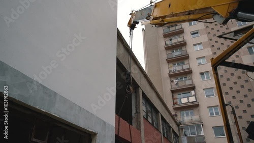 Crane Lifting Cut Concrete Panel. Construction and Heavy Lifting
