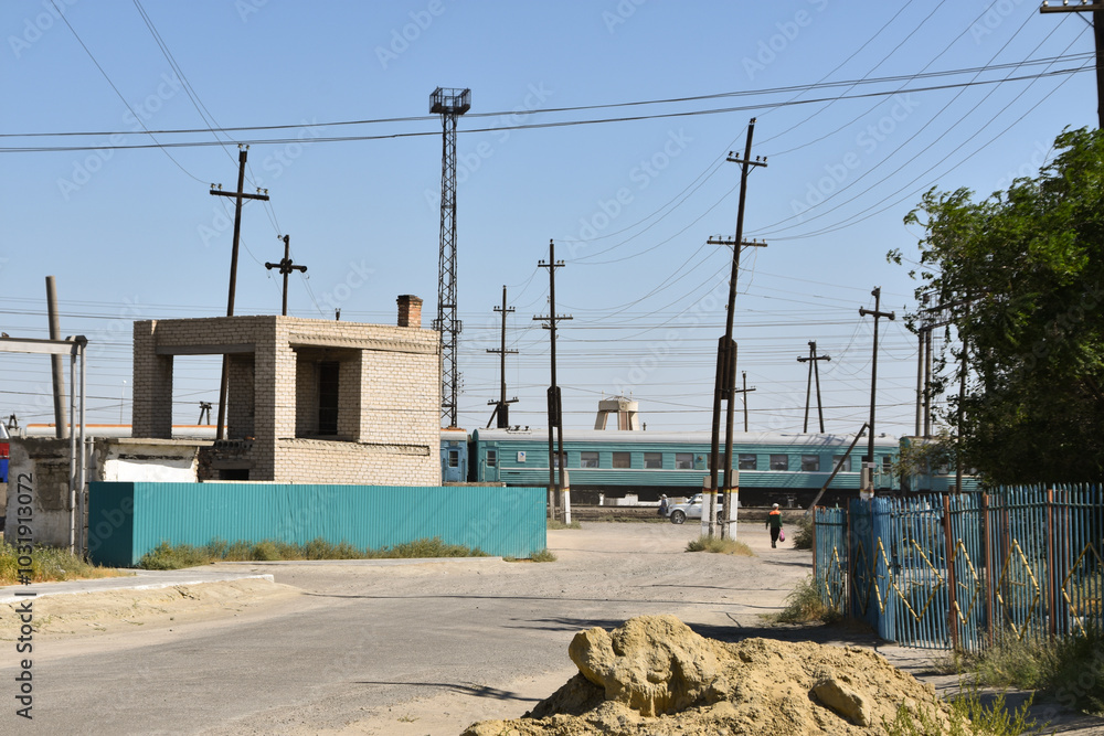 A train at the level crossing in Aral, Kazakhstan A train at the level crossing in Aral, Kazakhstan