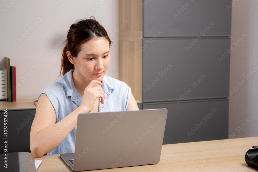 Young caucasian business woman working with laptop while thinking for planning financial on desk in modern home office, businesswoman planning and thoughtful about working, business concept. Young caucasian business woman working with laptop while thinking for planning financial on desk in modern home office, businesswoman planning and thoughtful about working, business concept.