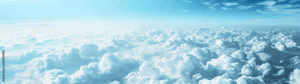 Expansive view of fluffy white clouds under a bright blue sky. Banner or header Expansive view of fluffy white clouds under a bright blue sky. Banner or header